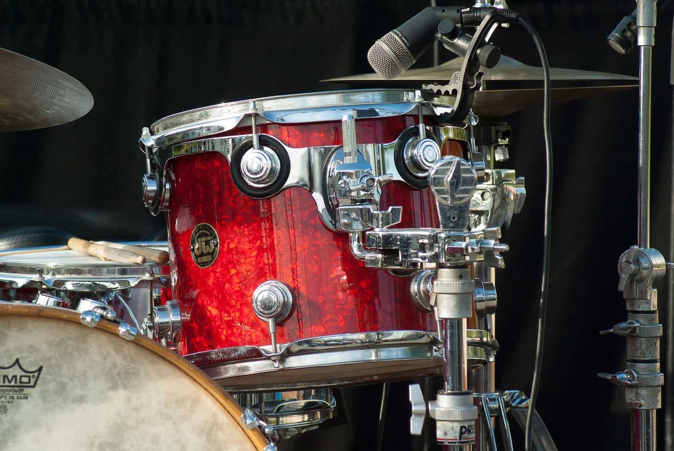 Red drums with a recording microphone on a stage